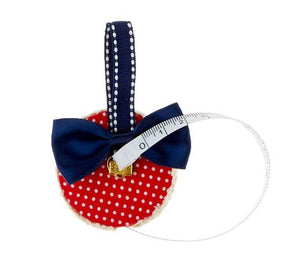 Red and White Fabric Covered Measuring Tape